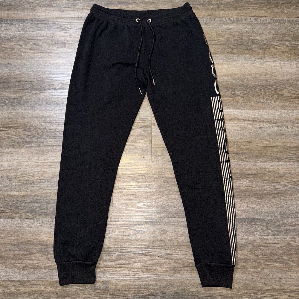 Bebe Sport Jogger Pants Black Drawstring Silver Logo Print Running Down Left Leg